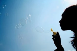 Girl blowing bubbles.