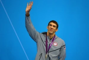 Silver medallist Michael Phelps of the United States waves to the crowd from the podium during the medal ceremony for the Men's 200m Butterfly final Silver medallist Michael Phelps of the United States waves to the crowd from the podium during the medal ceremony for the Men's 200m Butterfly final