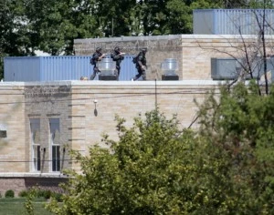 Police SWAT officers surround the Sikh Temple of Wisconsin Police SWAT officers surround the Sikh Temple of Wisconsin
