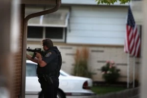 Police secure a neighborhood where the gunman lived who is suspected of opening fire at the Sikh Temple of Wisconsin Police secure a neighborhood where the gunman lived who is suspected of opening fire at the Sikh Temple of Wisconsin