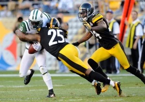 Santonio Holmes can't hold onto the ball after being hit by Ryan Clark of the Pittsburgh Steelers Santonio Holmes can't hold onto the ball after being hit by Ryan Clark of the Pittsburgh Steelers
