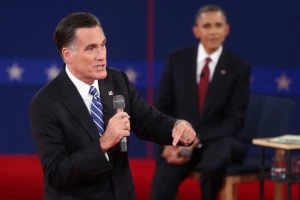 Mitt Romney (L) speaks as U.S. President Barack Obama listens during a town hall style debate at Hofstra University Mitt Romney (L) speaks as U.S. President Barack Obama listens during a town hall style debate at Hofstra University