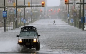car drives down a flooded street as Hurricane Sandy moves up the coast in Atlantic City, N car drives down a flooded street as Hurricane Sandy moves up the coast in Atlantic City, N