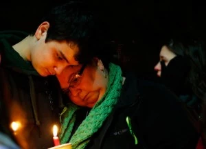 Donna Soto (R), mother of Victoria Soto, the first-grade teacher at Sandy Hook Elementary School who was shot and killed while protecting her students, leans on her son Matthew while mourning their loss at a candlelight vigil in honor of Victoria at Stratford High School Donna Soto (R), mother of Victoria Soto, the first-grade teacher at Sandy Hook Elementary School who was shot and killed while protecting her students, leans on her son Matthew while mourning their loss at a candlelight vigil in honor of Victoria at Stratford High School