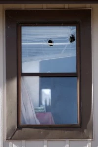 Bullet holes are seen in an upper window of a town home where four people were killed Saturday morning in Aurora, Colorado Bullet holes are seen in an upper window of a town home where four people were killed Saturday morning in Aurora, Colorado