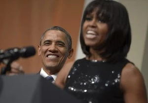 President Barack Obama listens as First Lady Michelle Obama delivers remarks at the Inaugural Reception at the National Building Museum President Barack Obama listens as First Lady Michelle Obama delivers remarks at the Inaugural Reception at the National Building Museum