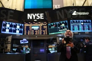 Traders work on the floor of The New York Stock Exchange Traders work on the floor of The New York Stock Exchange