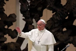 Newly elected Pope Francis gestures after entering the hall as he holds his first audience with journalists and media inside the Paul VI hall Newly elected Pope Francis gestures after entering the hall as he holds his first audience with journalists and media inside the Paul VI hall