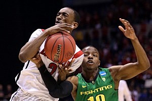 Russ Smith #2 of the Louisville Cardinals drives in the second half against Johnathan Loyd #10 of the Oregon Ducks Russ Smith #2 of the Louisville Cardinals drives in the second half against Johnathan Loyd #10 of the Oregon Ducks
