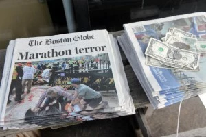 Newspapers are on sale at a stand on Newbury Street Newspapers are on sale at a stand on Newbury Street
