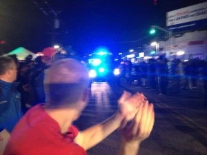 Crowds in Watertown cheer the police car carrying suspect Crowds in Watertown cheer the police car carrying suspect