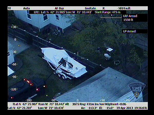 Photo from Massachusetts State Police Air Wing shows law enforcement approaching boat where Boston Marathon suspect Dzhokhar Tsarnaev hid Photo from Massachusetts State Police Air Wing shows law enforcement approaching boat where Boston Marathon suspect Dzhokhar Tsarnaev hid