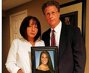 Paige Aiello's parents Robin and Christopher hold her portrait in a picture sent to Townsquare Media Paige Aiello's parents Robin and Christopher hold her portrait in a picture sent to Townsquare Media