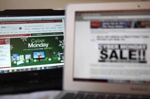 In this photo illustration, an ad seen on the Target website for a Cyber Monday sale is displayed on laptop computers In this photo illustration, an ad seen on the Target website for a Cyber Monday sale is displayed on laptop computers