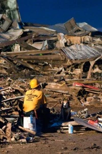 , a rescue worker and his search dog sit during the search for survivors in the remains of the Plaza Towers Elementary School , a rescue worker and his search dog sit during the search for survivors in the remains of the Plaza Towers Elementary School