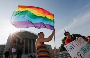 Gay rights supporter Vin Testa waves a rainbow flag outside the U.S. Supreme Court building Gay rights supporter Vin Testa waves a rainbow flag outside the U.S. Supreme Court building