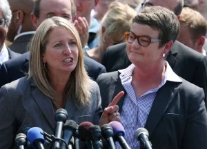 Plantiff couple Sandy Steier (L) and Kris Perry speak to the media after the U.S. Supreme Court ruled that part of the Defense of Marriage Act (DOMA) is unconstitutional Plantiff couple Sandy Steier (L) and Kris Perry speak to the media after the U.S. Supreme Court ruled that part of the Defense of Marriage Act (DOMA) is unconstitutional
