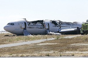 The wreckage of Asiana Airlines flight 214 lies near the runway at San Francisco Airport The wreckage of Asiana Airlines flight 214 lies near the runway at San Francisco Airport