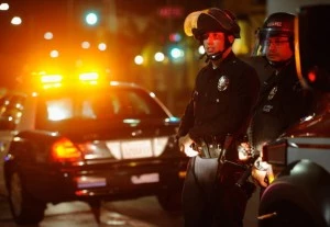 Los Angeles Police Department officers in riot gear look at protestors in the streets around Leimert Park following a prayer vigil against the acquittal of George Zimmerman Los Angeles Police Department officers in riot gear look at protestors in the streets around Leimert Park following a prayer vigil against the acquittal of George Zimmerman