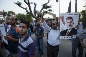 Supporters of deposed Egyptian President Mohammed Morsi gather on the Nile River corniche in the Maadi district to protest the recent killing of protesters by Egyptian Security Forces Supporters of deposed Egyptian President Mohammed Morsi gather on the Nile River corniche in the Maadi district to protest the recent killing of protesters by Egyptian Security Forces