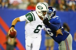 Mark Sanchez is sacked by Marvin Austin Mark Sanchez is sacked by Marvin Austin
