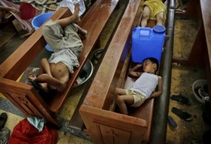 Residents take shelter in a church in the aftermath of Typhoon Haiyan Residents take shelter in a church in the aftermath of Typhoon Haiyan