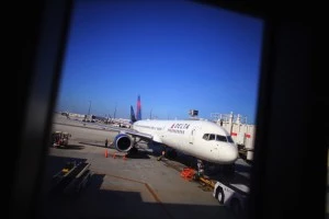 A Delta airlines plane sits at the gate in LaGuardia Airport A Delta airlines plane sits at the gate in LaGuardia Airport