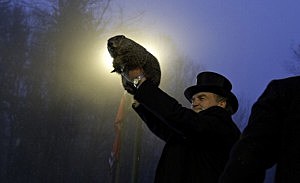 Groundhog handler John Griffiths holds Punxsutawney Phil after he saw his shadow predicting six more weeks of winter during 128th annual Groundhog Day festivities Groundhog handler John Griffiths holds Punxsutawney Phil after he saw his shadow predicting six more weeks of winter during 128th annual Groundhog Day festivities