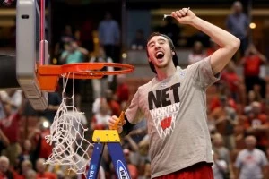 Frank Kaminsky #44 of the Wisconsin Badgers celebrates after he cuts down the net after defeating the Arizona Wildcats 64-63 in overtime Frank Kaminsky #44 of the Wisconsin Badgers celebrates after he cuts down the net after defeating the Arizona Wildcats 64-63 in overtime