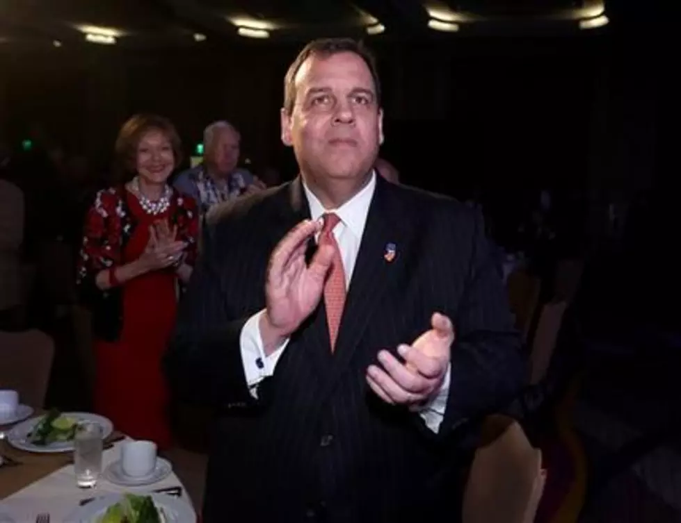While snow falls in NJ, Christie hits the road
