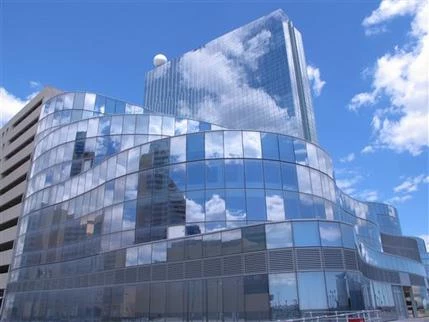 Clouds are reflected in the glass exterior of the former Revel casino in Atlantic City