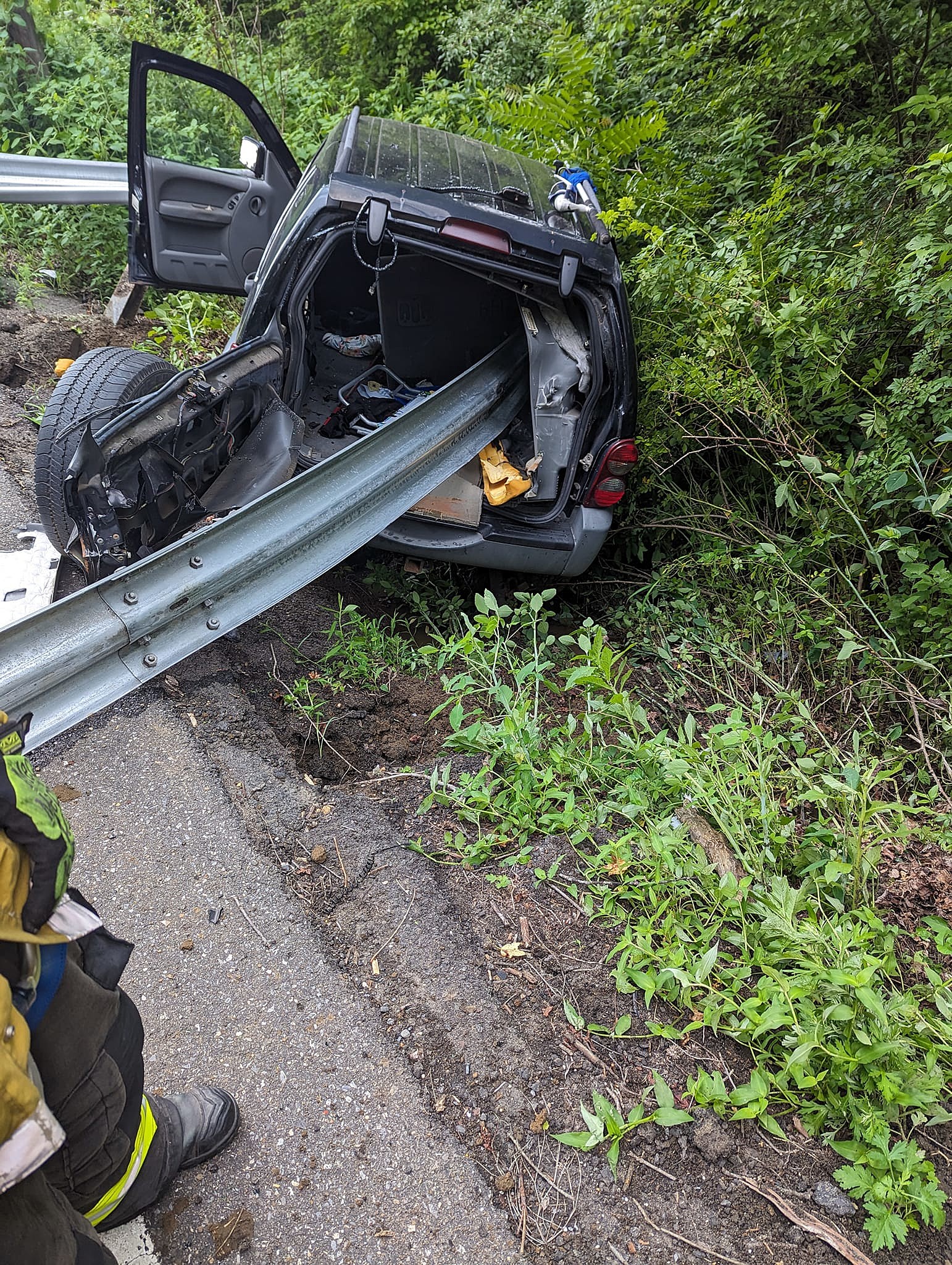 The driver of this SUV miraculously survived his vehicle getting impaled by a guardrail during an accident in Roosevelt, NJ. Photo: Millstone Township Fire Department via Facebook