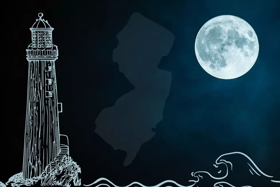 NJ Lighthouse at night with a full moon