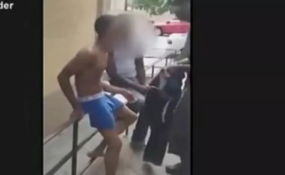 Screen shot of Newark teen stripping for Newark police officer