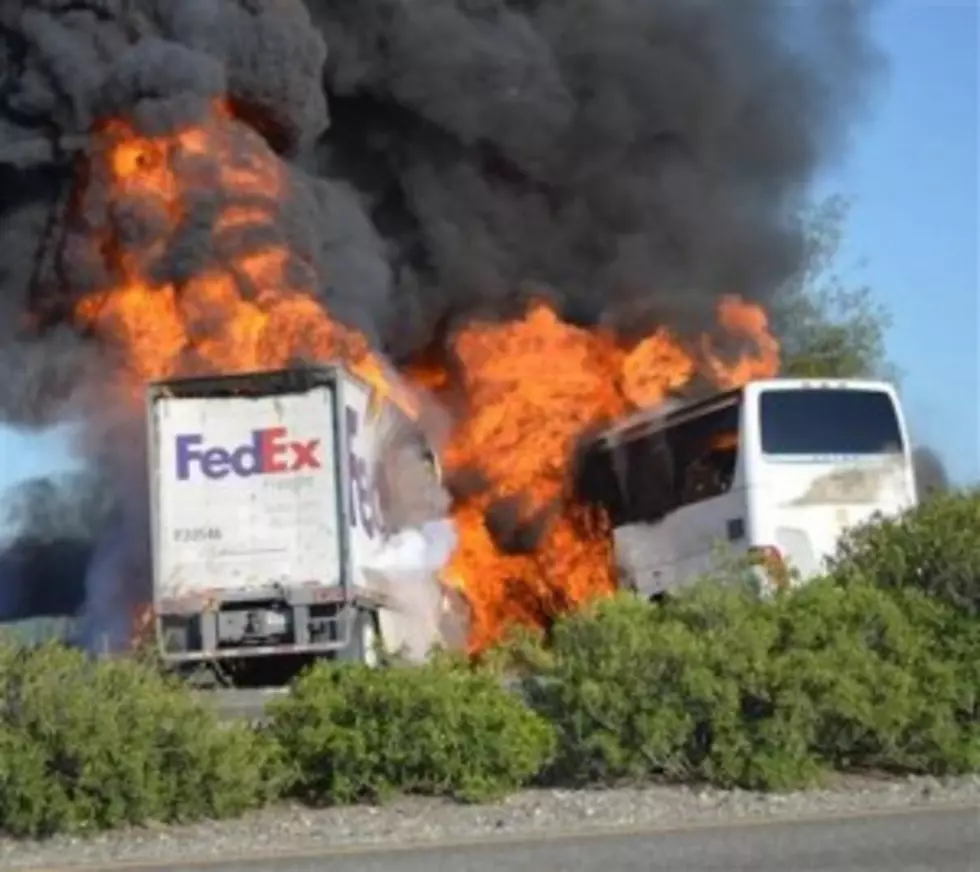 Massive flames are seen devouring both vehicles just after a crash between a bus and FedEx truck in California