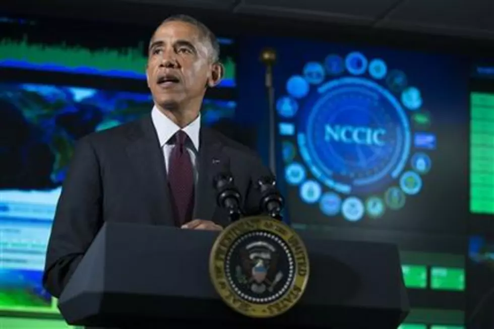 FILE - In this Jan. 13, 2015 file photo, President Barack Obama speaks at the National Cybersecurity and Communications Integration Center in Arlington, Va. The Homeland Security Department opened up shop Thursday as a portal for sharing cyber threats with the private sector and the rest of government _ a culmination of a longtime bipartisan effort to improve information flow and cybersecurity. (AP Photo/Evan Vucci)