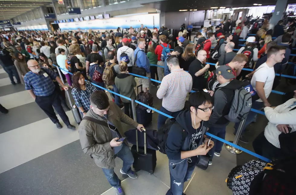 CHICAGO, IL - MAY 16: Passengers at O'Hare International Airport wait in line to be screened at a Transportation Security Administration (TSA) checkpoint on May 16, 2016 in Chicago, Illinois. Waiting times at the checkpoints today have been reported to be as long 2 hours. The long lines have been blamed for flight delays and a large number of passengers missing flights completely. (Photo by Scott Olson/Getty Images)