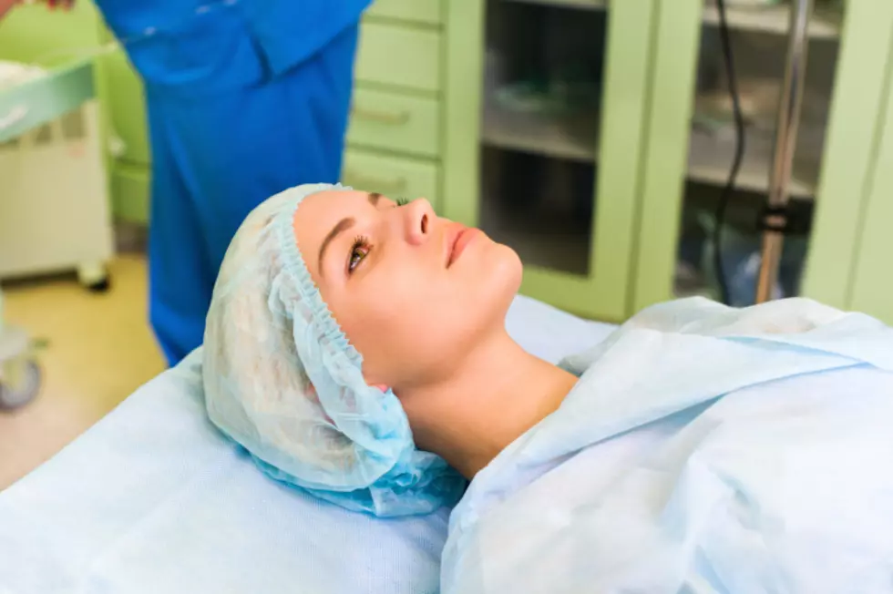 woman lying in surgery room