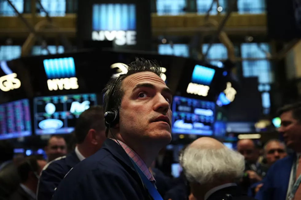 Late sell-off leaves US stocks barely higher; oil rises