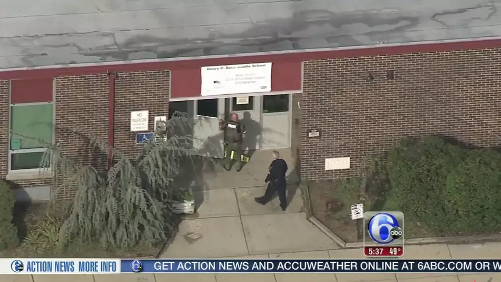 Police enter the Beck Middle School in Cherry Hill to investigate a bomb threat
