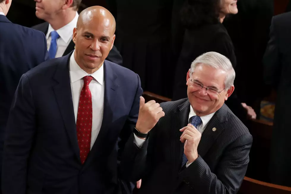 Sen. Cory Booker and Sen. Bob Menendez arrive to a joint session of the U.S. Congress to hear an address by President Donald Trump