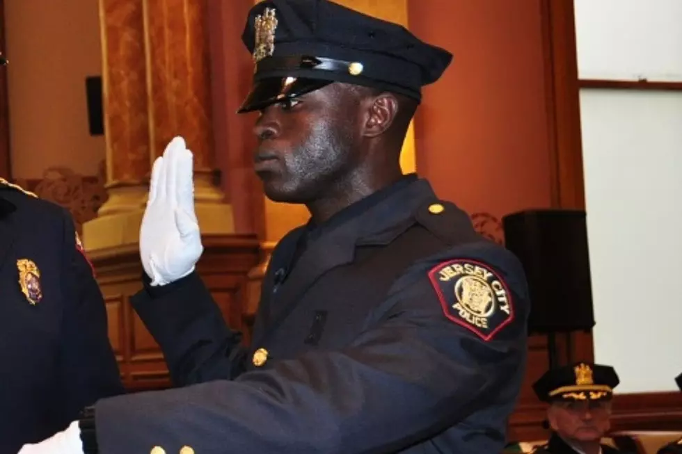 Jersey City police officer Morton Otundo being sworn into office in 2013