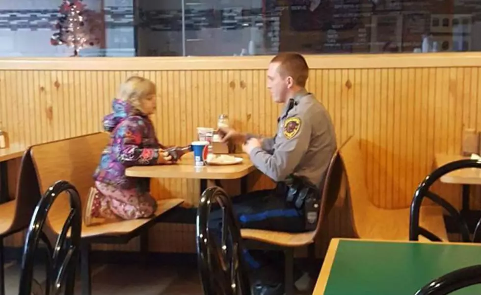 Officer Brett Hansen in a quite moment with his daughter (Toms River Police Dept.)